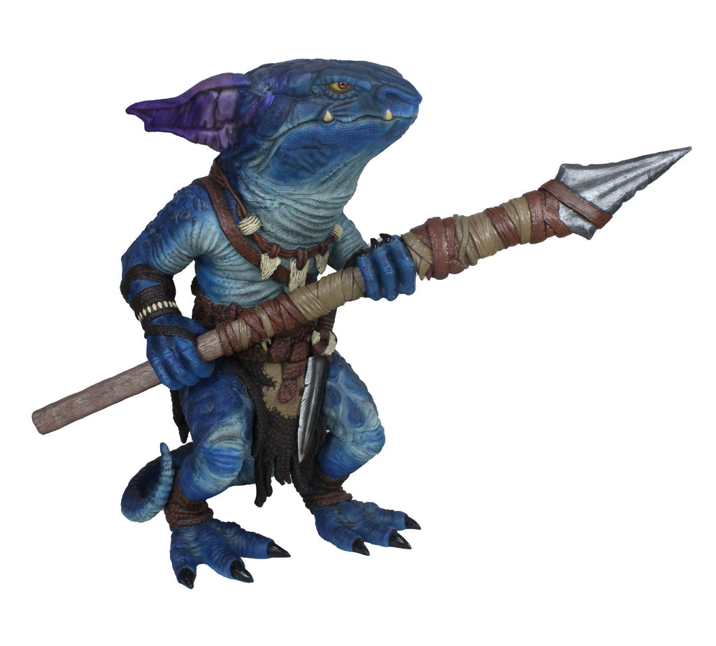 Blue, scaly, reptilian kobold figure with purple ears and yellow eyes, wearing tribal gear, holding a large spear