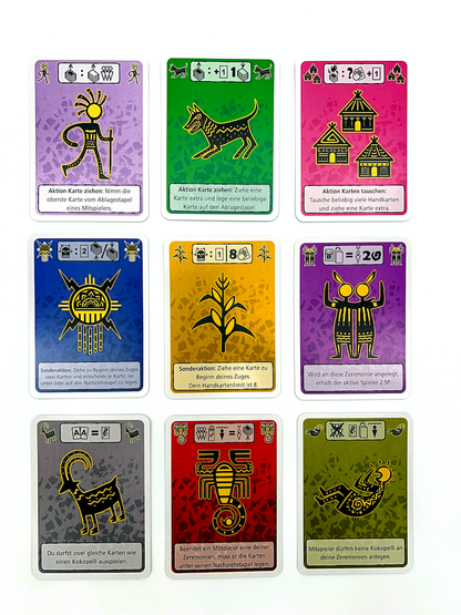 Game components laid out, including tribal-themed cards and small tokens