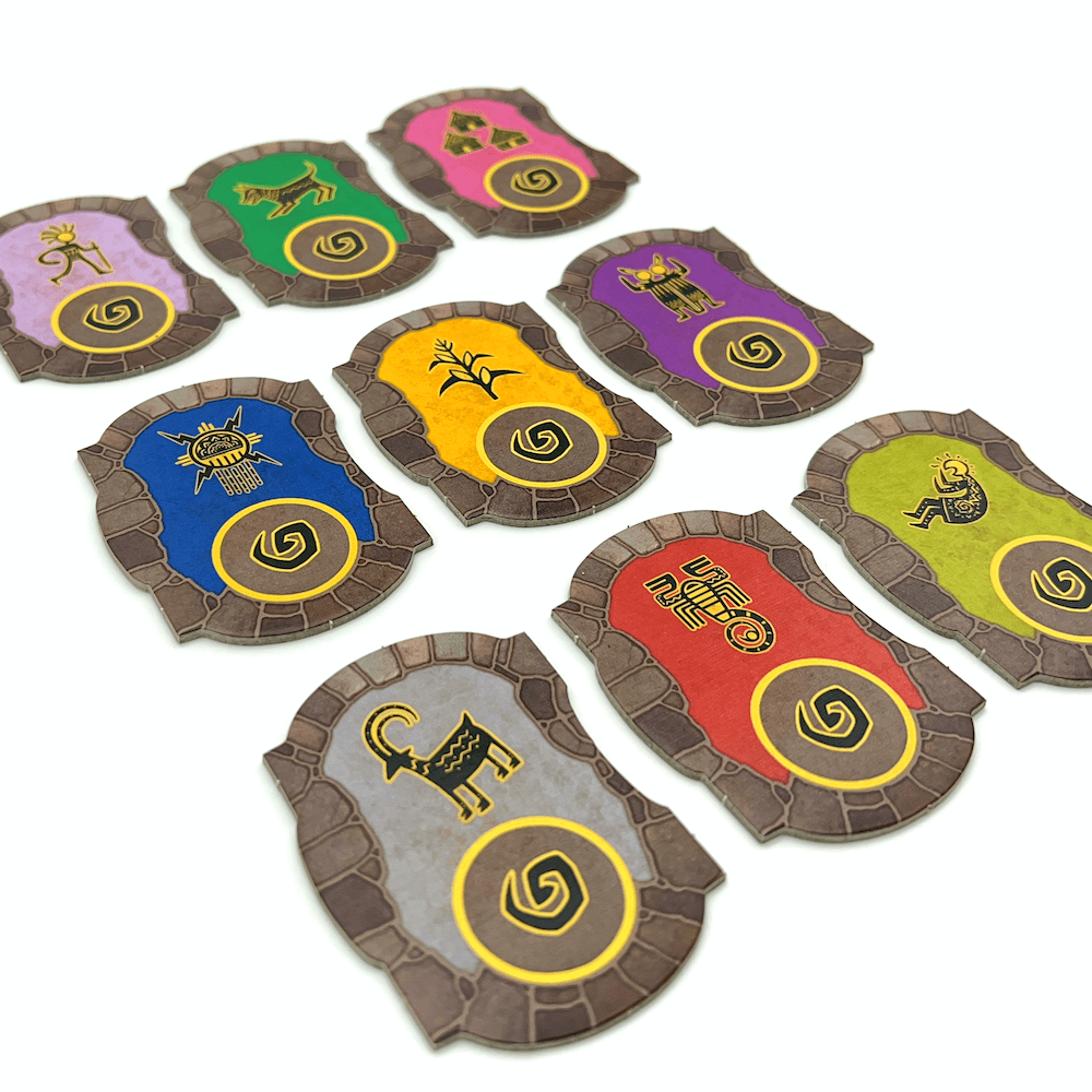 Several cards with vivid Kokopelli artwork, spread across a wooden surface