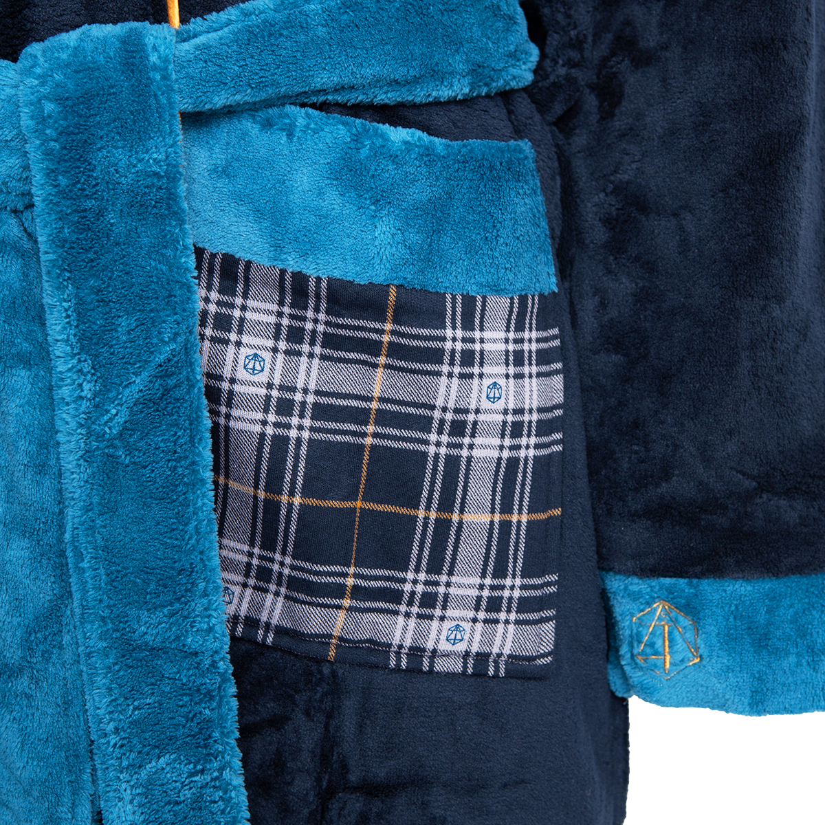 Close-up of a  navy blue lavish chateau bathrobe with teal accents, a plaid pocket, and a gold D20-like symbol