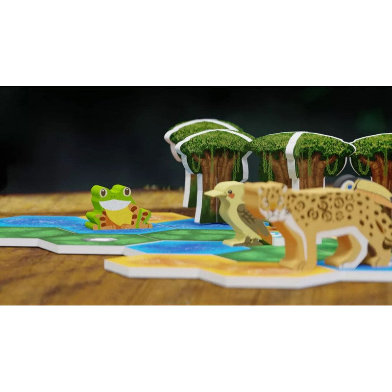 Life of the Amazonia wooden game pieces a frog kookaburra and jaguar on hex tiles and trees
