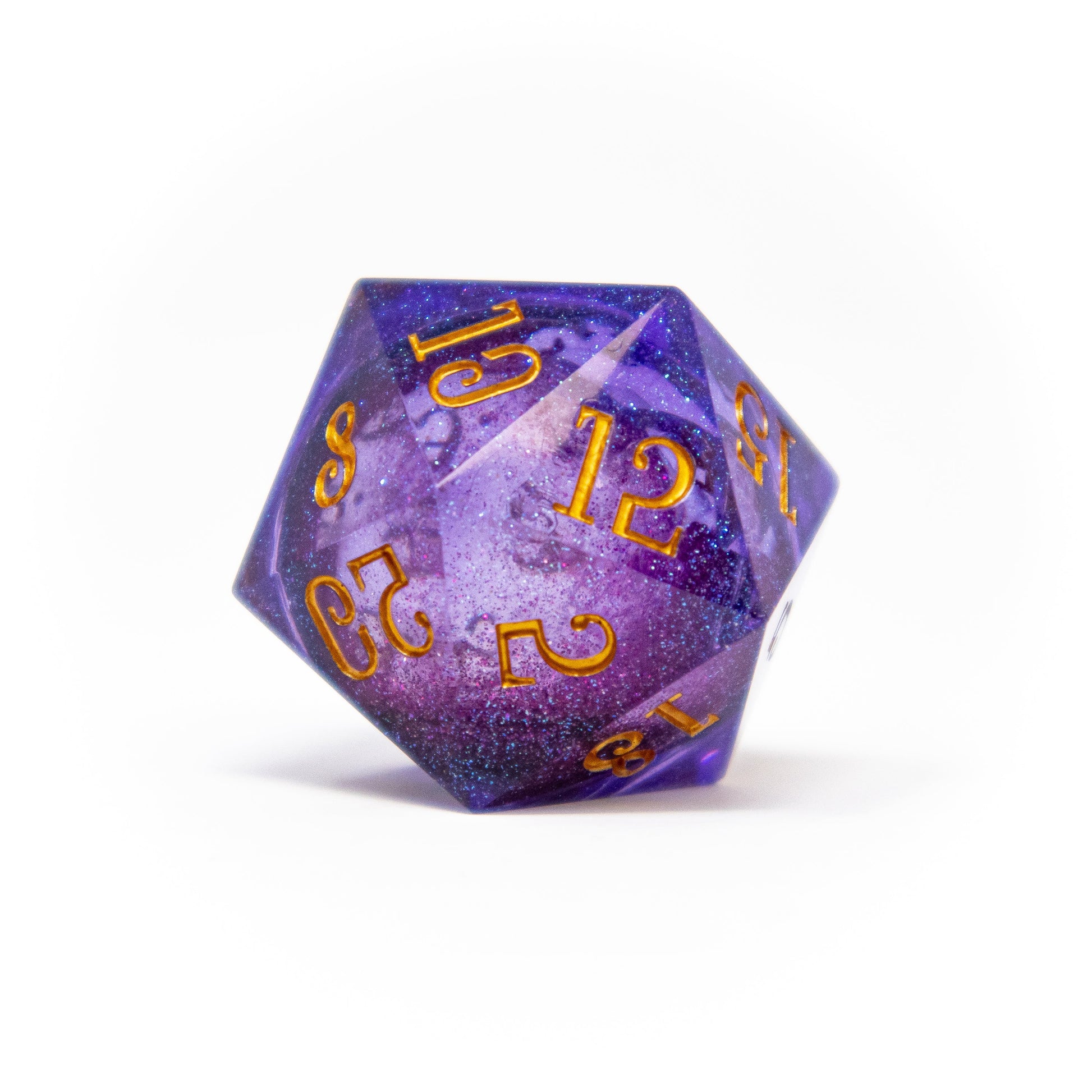 A galaxy-themed purple D20 die with gold numbers, showing 12 prominently, on a white background