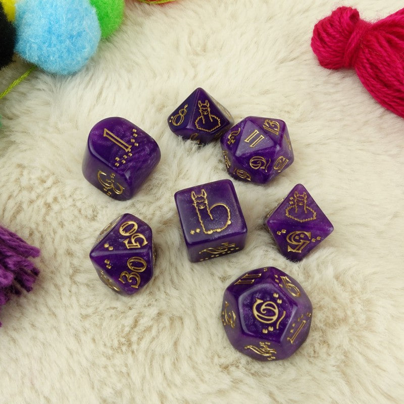 Seven purple polyhedral dice with gold numbers and a llama symbol on a white fluffy background