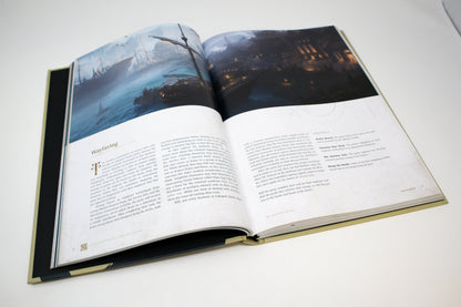 Open fantasy book: Left page depicts stormy sea with sailing ships; right page shows a dark port city at night, with accompanying text.