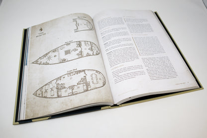 Open rulebook displaying detailed ship deck plans for "The Moxi VII" on the left page and descriptive text on the right.