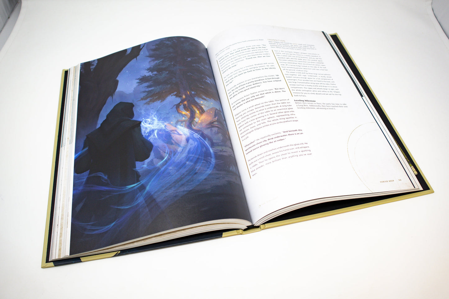 Open book showing a cloaked figure casting blue magic, forming an ethereal figure beside a glowing tree at night.