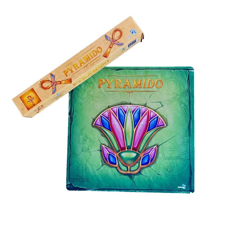 Pyramido game box (green with a lotus design) and a brown playmat tube with Ankh symbols