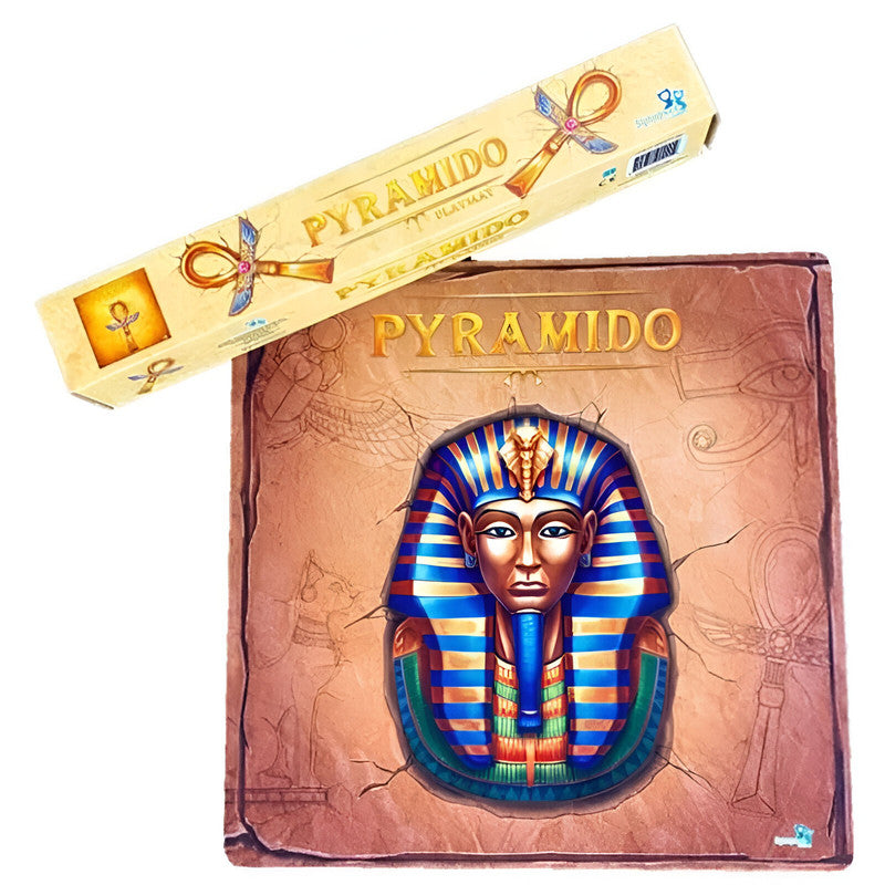 Pyramido game box featuring a colorful pharaoh mask, next to a smaller, long box adorned with ankhs