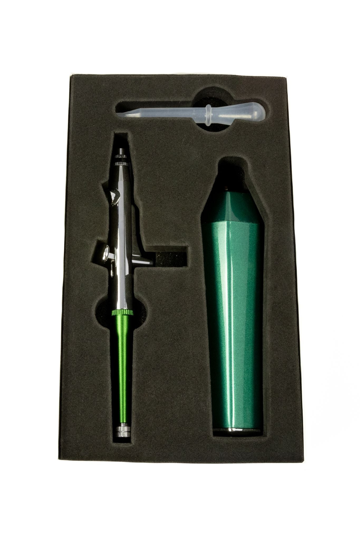 Green and chrome airbrush kit, including the handheld sprayer and portable compressor, displayed in black foam packaging