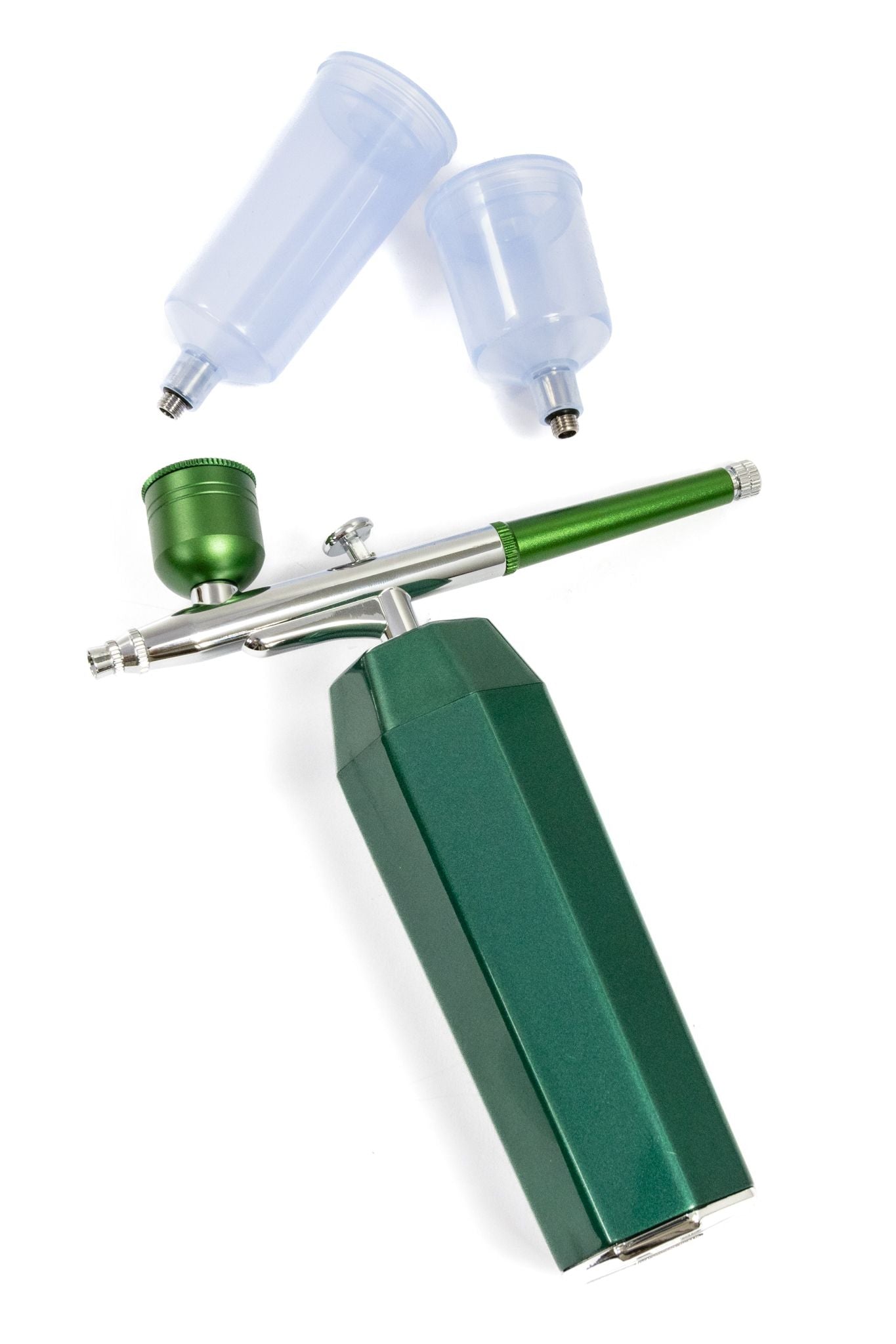 Green handheld airbrush kit with compressor unit and two detached clear paint cups