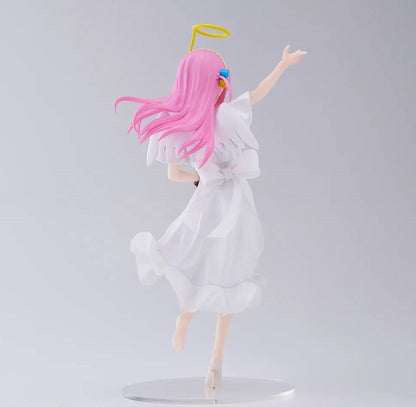 Rear view of seated figure showing hair detail and guitar strap over shoulder