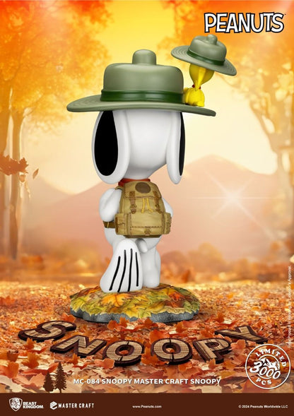 Snoopy Master Craft figure with backpack and hat Yellow Woodstock bird on hat standing on fall leaves
