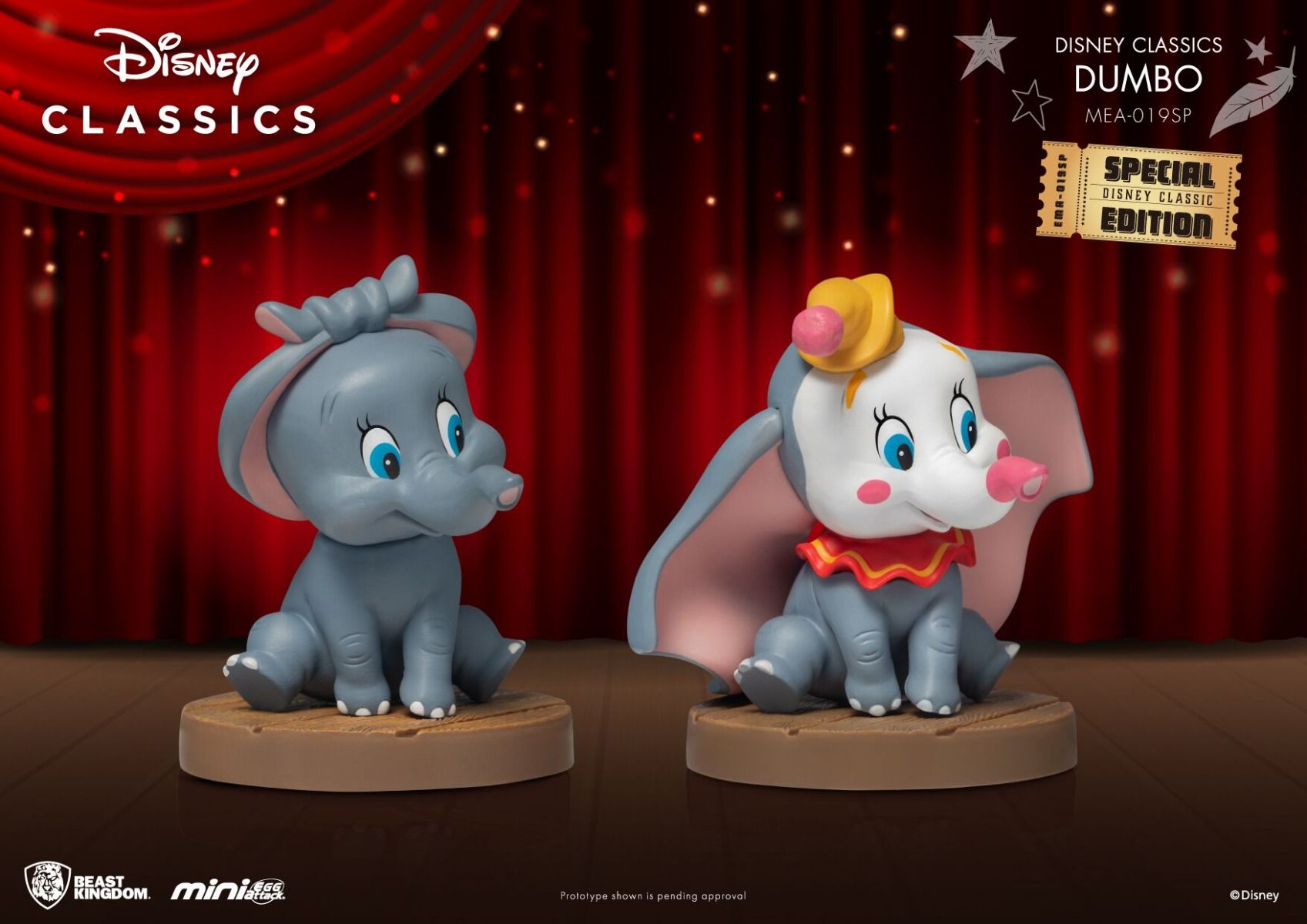 Two adorable mini figures of Dumbo and a blue elephant friend against a red stage curtain background