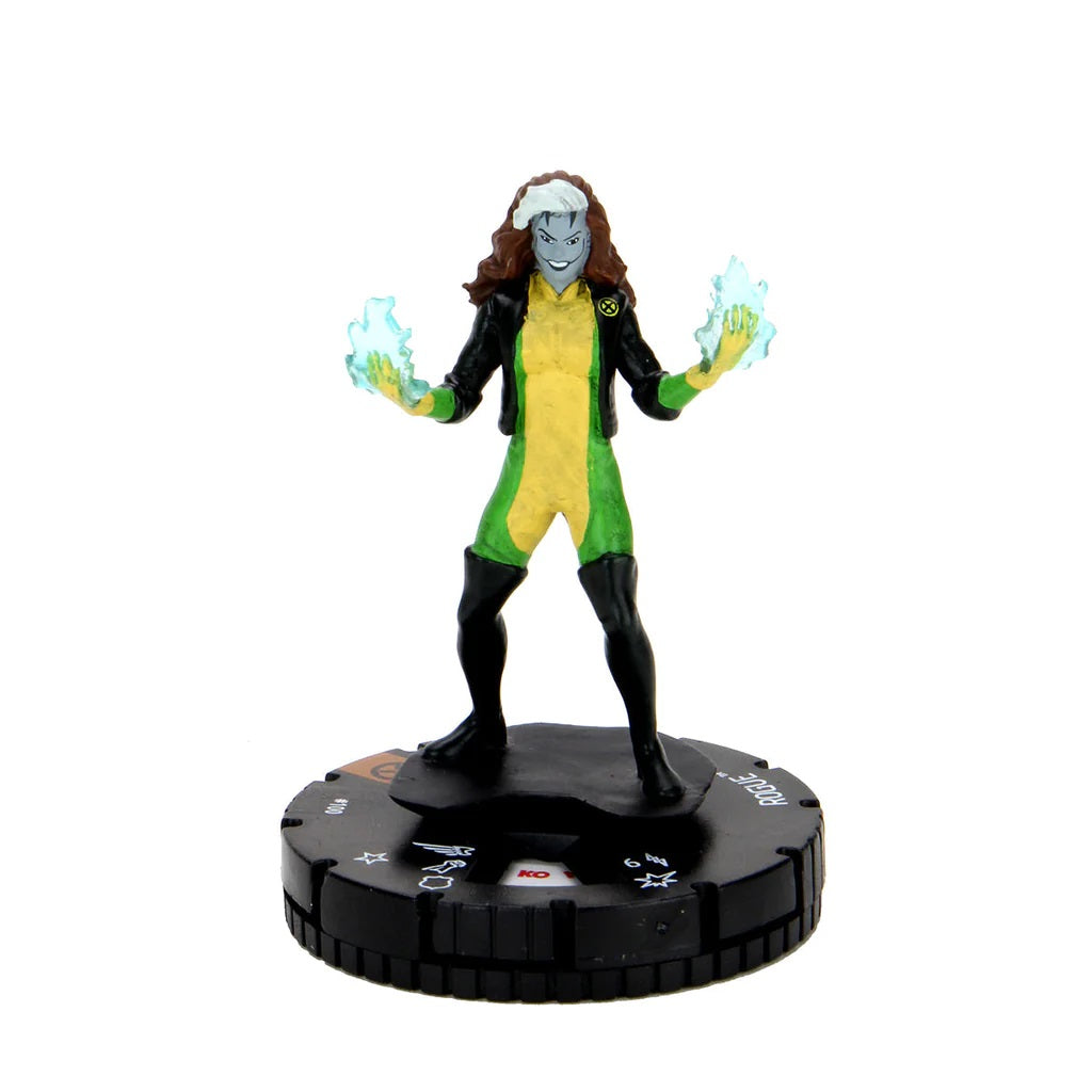 X-Men's Rogue figure in green and yellow with a black jacket, hands glowing with blue energy, on a game base