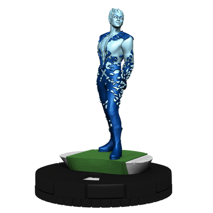 A light blue and dark blue miniature figure with a fragmented ice-like design standing on a green base
