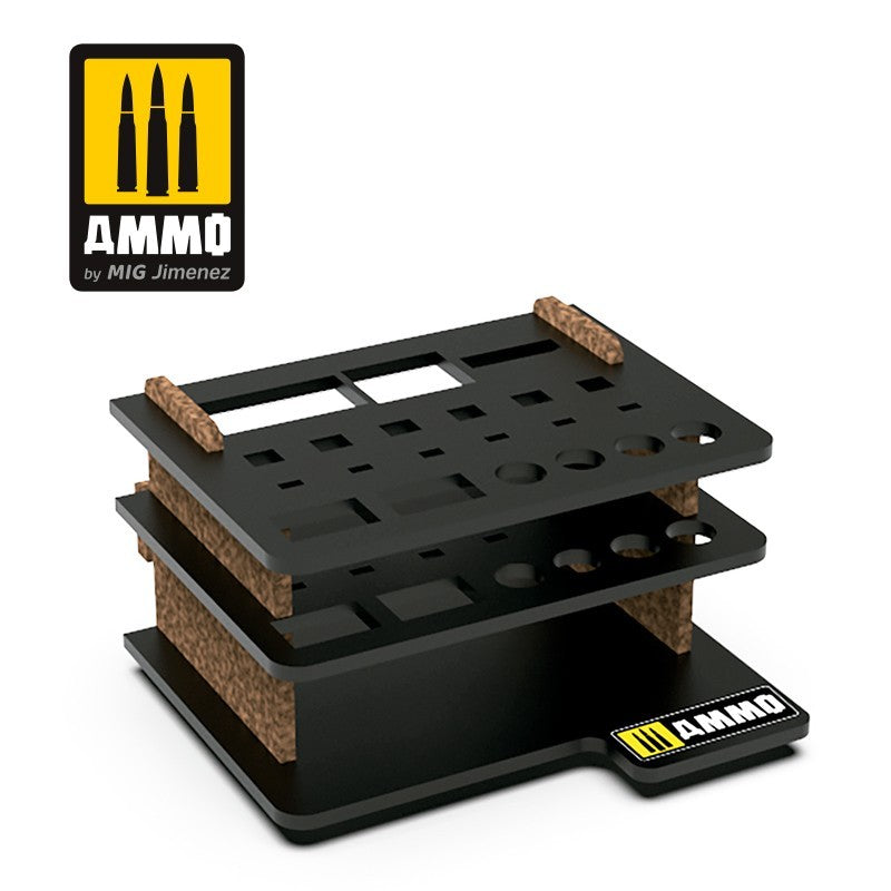 An empty, black, multi-tiered AMMO brand organizer with brown supports and varied cutouts for hobby tools and paints