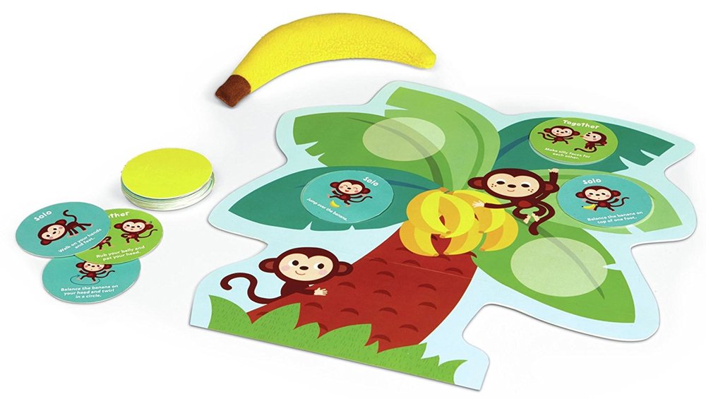 Monkey Around Wiggle &amp; Giggle Game with plush banana, lilypad board, and activity cards