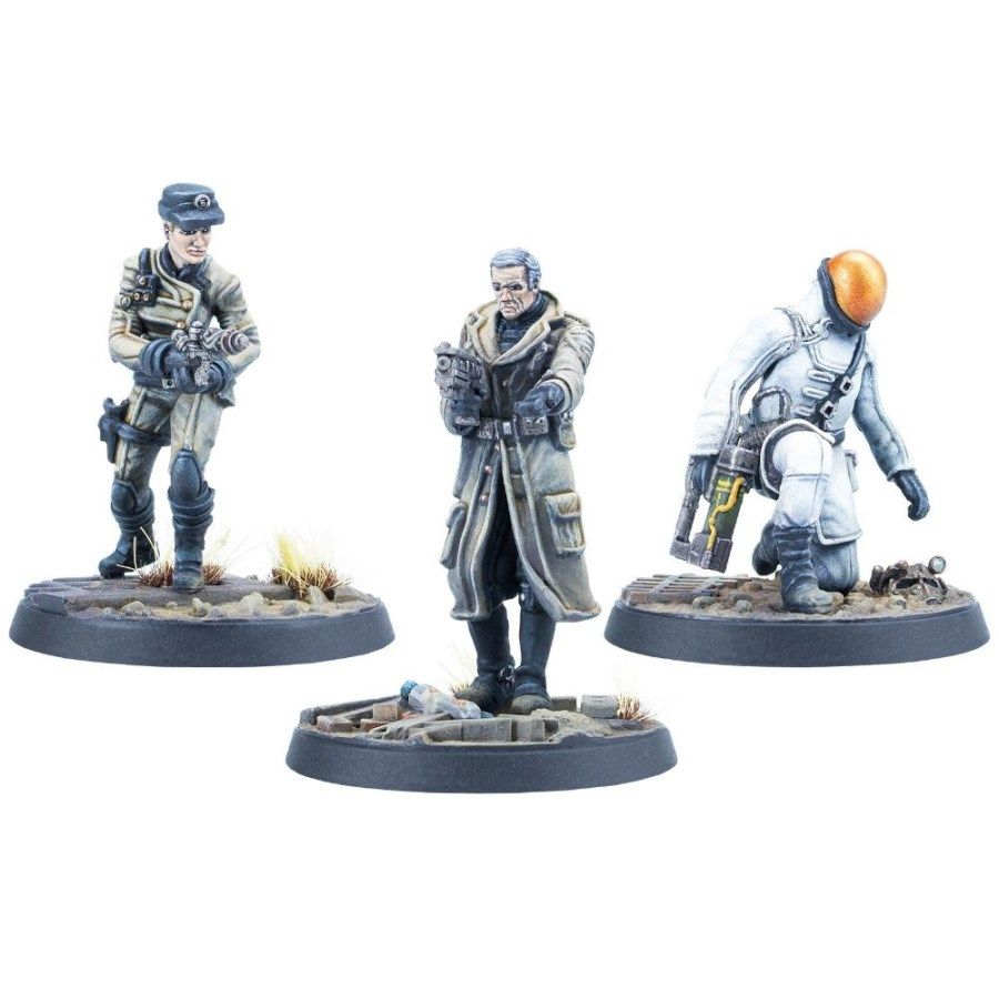 Three painted miniatures: a standing female soldier, a man in a long coat, and a kneeling astronaut with a robot. All armed.