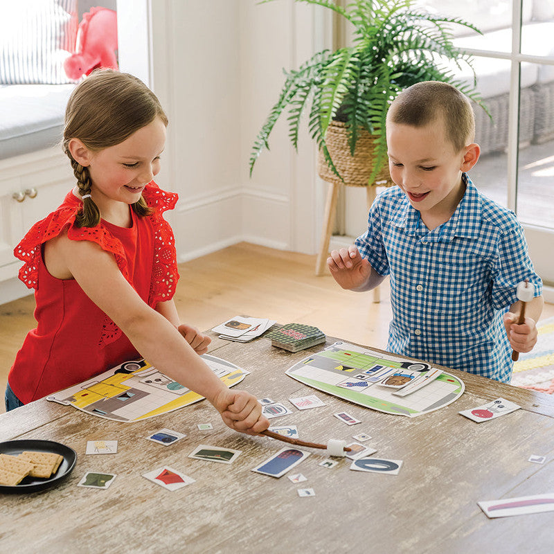 Kids play MindWare Slappy Camper game on wooden table