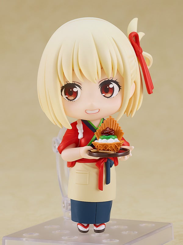 Chisato with arms crossed and serious face
