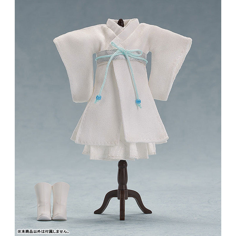 White kimono outfit with silver ribbon and blue beads on a mannequin includes matching white boots