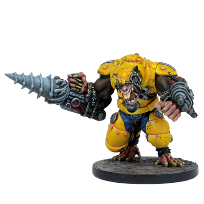 Miniature of a fierce, brown-skinned monster in yellow armor, with a large drill arm and heavy weapon arm