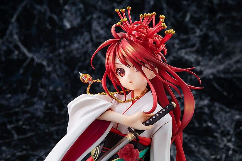 Detailed anime figure of a young woman with long red hair and a striking floral headdress wearing
