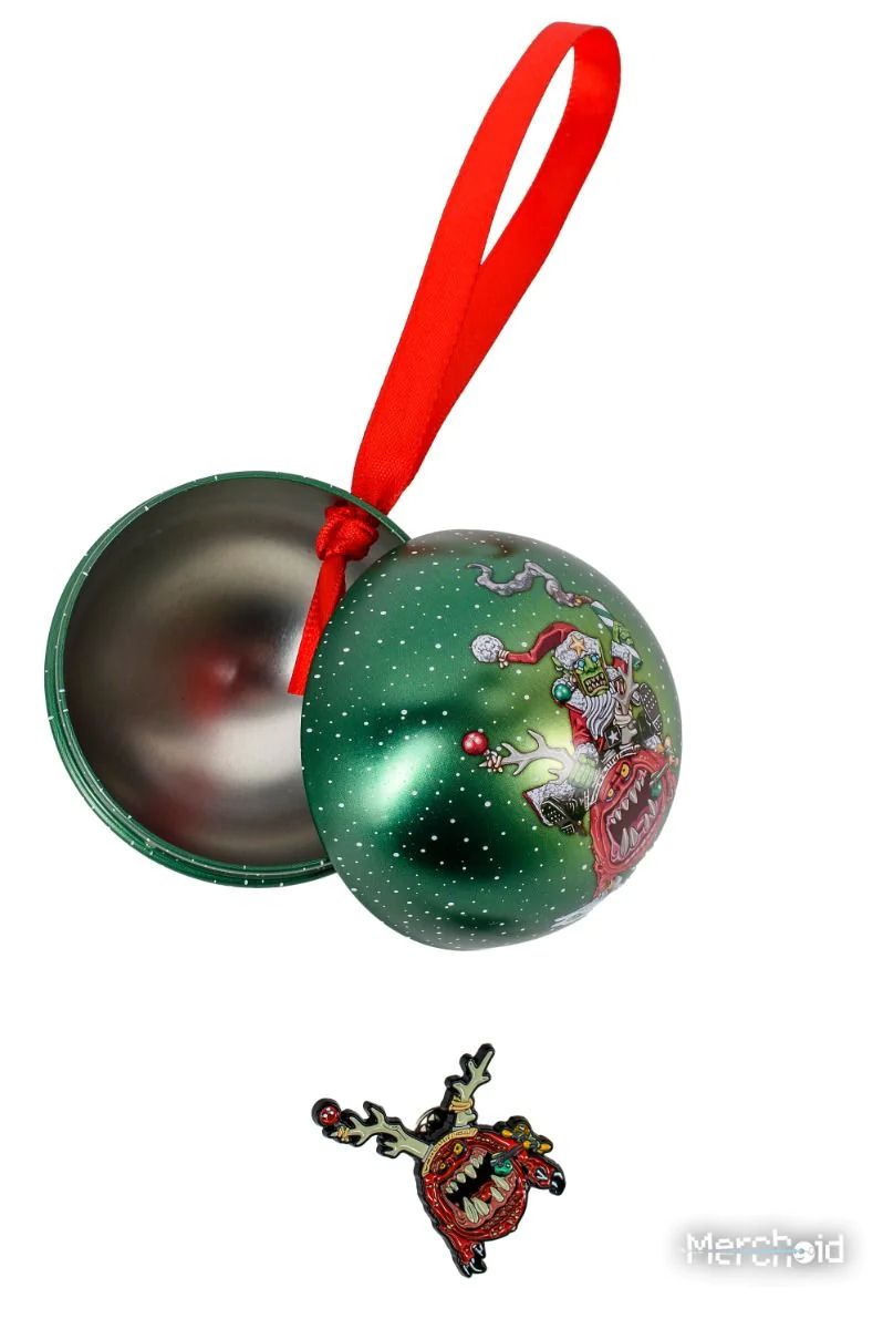 Opened green metal Christmas Squig Bauble with monstrous Santa design, plus a matching monster reindeer pin