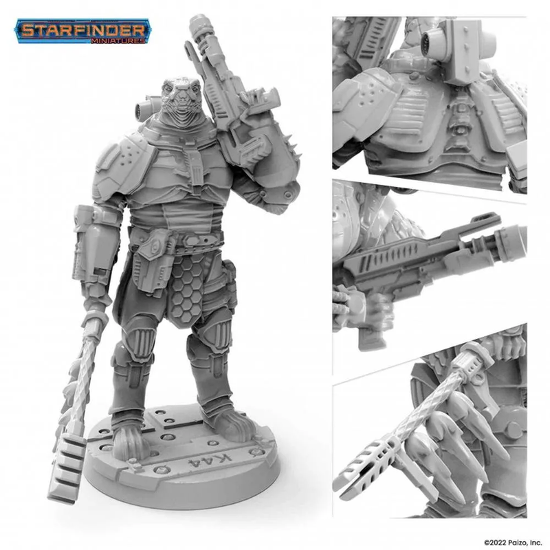 A gray Starfinder Obozaya Vesk Soldier miniature of an armored alien warrior holding a futuristic rifle and a staff