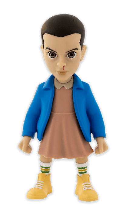 Minix Stranger Things Eleven collectible vinyl figure with blue jacket pink dress and nosebleed wearing striped socks and yellow shoes