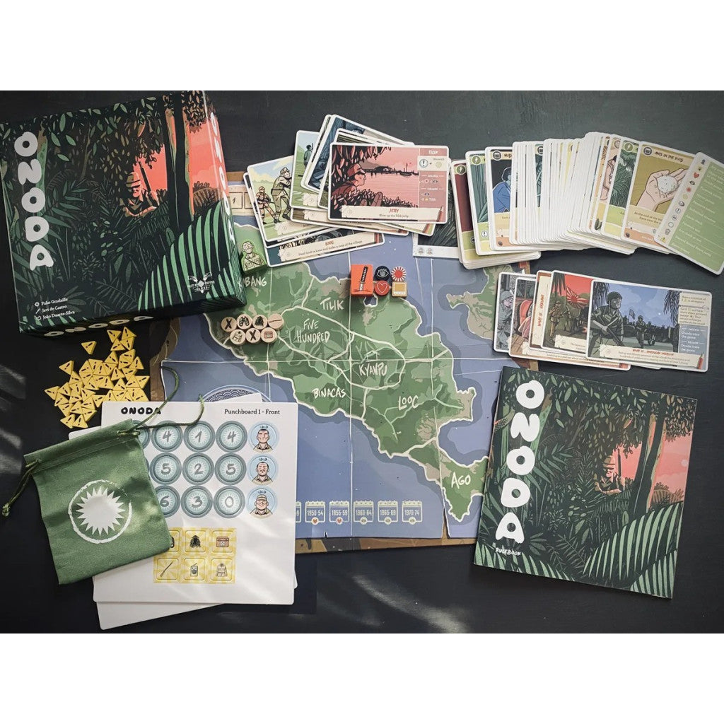 Full setup of the board game ONODA, showing the map, cards, tokens, and box against a dark background