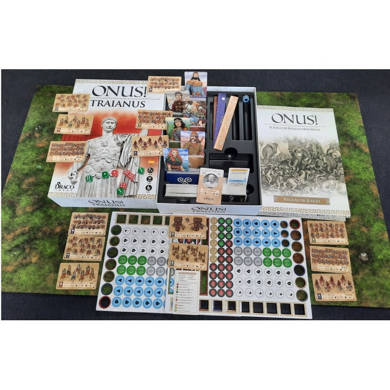 ONUS! TRAIANUS historical wargame components: boxes, rulebooks, unit cards, and tokens spread on a green battlemat.