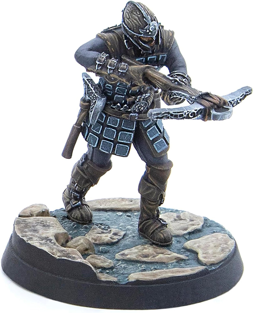 A dark-armored miniature warrior in a helmet aims a crossbow. Stands on a detailed rocky base.