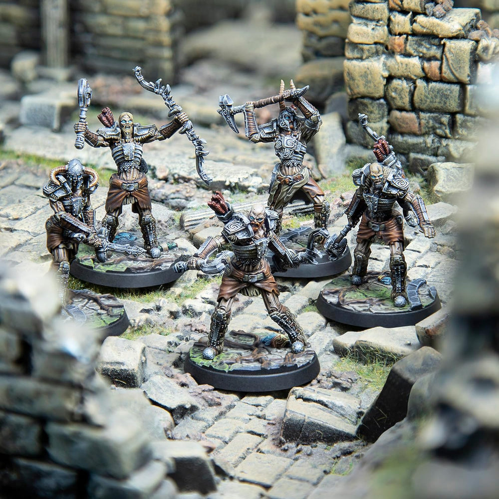 Five armored skeletal warrior miniatures wield bows, axes, and swords on rocky ruins.