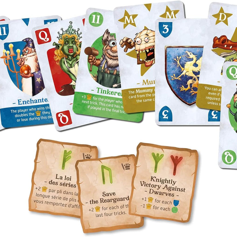 Close up of various illustrated fantasy board game cards showing characters like a wizard fairy mummy and crocodile along with rune scoring cards