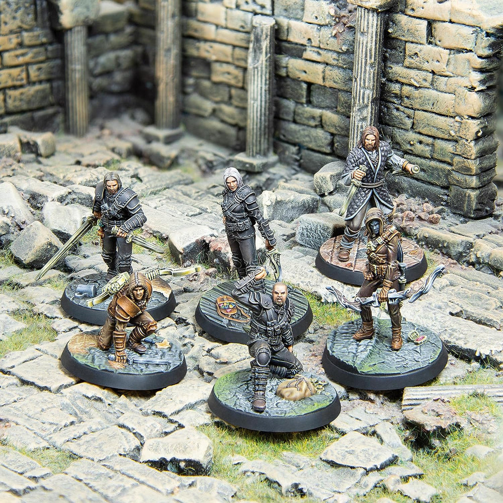 Six fantasy warrior miniatures, armed with swords and bows, standing and crouching amidst stone ruins.