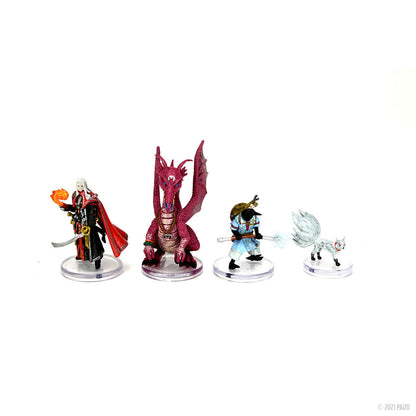Four fantasy miniatures: red-caped wizard with orange orb, three-eyed red dragon, crow-headed figure with staff, winged fox