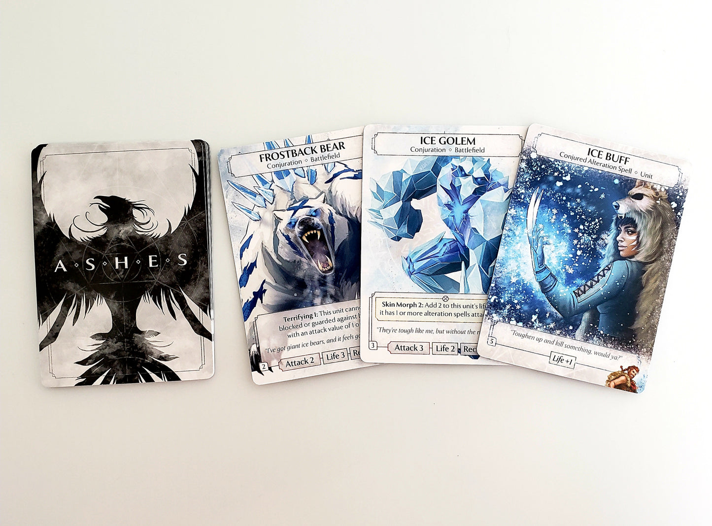 Ashes Reborn The Frostdale Giants card game set featuring a Phoenixborne character card and three ice-themed ally unit cards Frostback Bear Ice Golem and Ice Buff