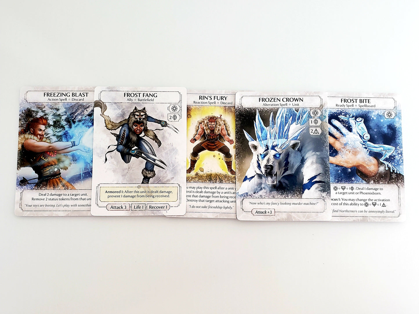 Ashes Reborn Frostdale Giants cards in a line featuring Freezing Blast Frost Fang Rin's Fury Frozen Crown and Frost Bite with character art and abilities