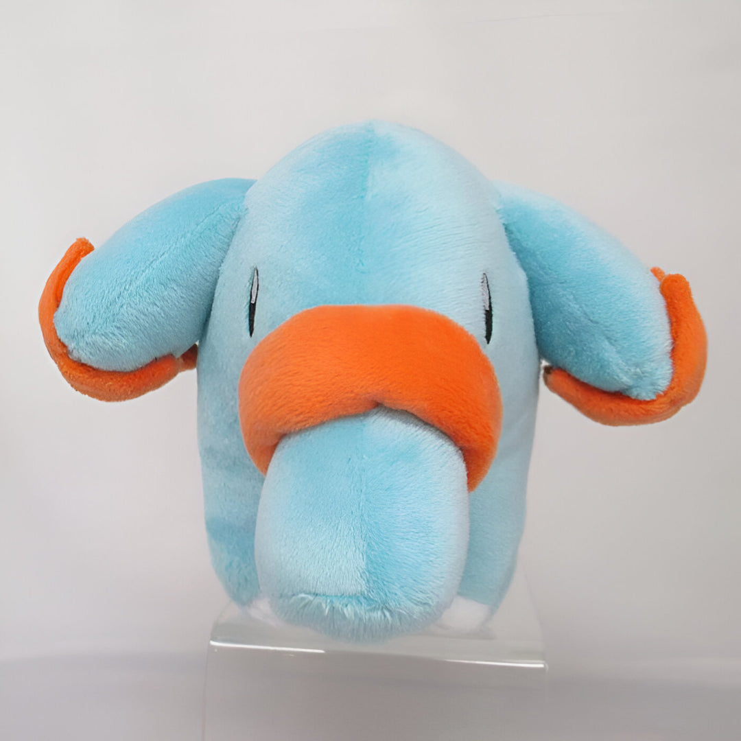 Blue and orange Pokémon Phanpy plush toy standing on a clear surface