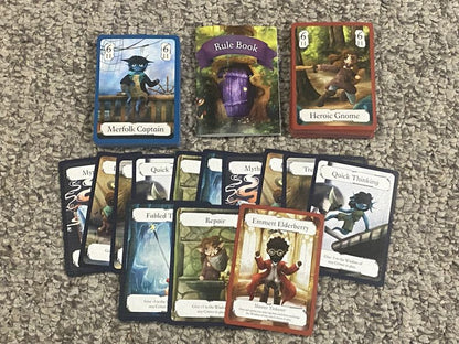 Detailed view of game cards featuring fantasy characters and stats on a table