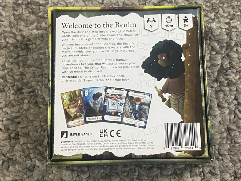 Fantasy card game display with multiple cards shown face up on a wooden surface