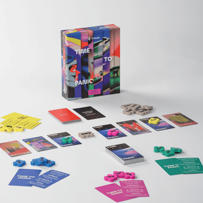 Time to Panic card game set: standing box, scattered multi-coloured cards, and tokens displayed on a white background