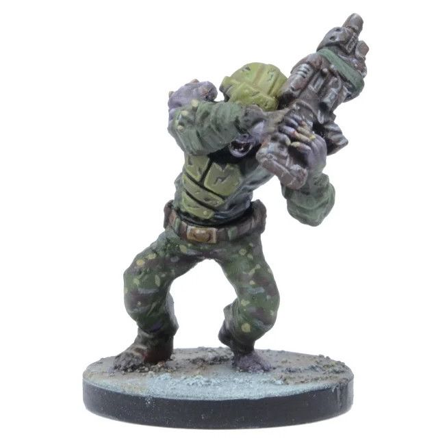 Miniature of a monstrous figure in green camouflage and armor, aiming a large sci-fi rifle