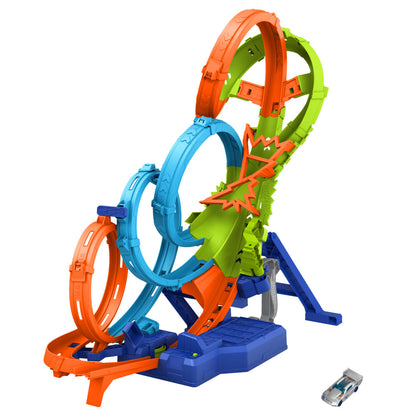 Colorful Hot Wheels stunt track with multiple loops, ramps, and a small silver toy car