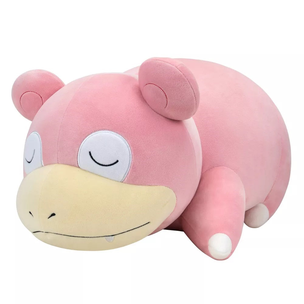 Pink Slowpoke Pokemon plush toy lying down and sleeping