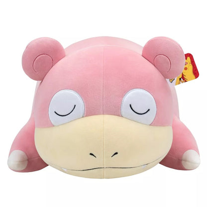 Pink Slowpoke Pokemon plush toy resting with closed eyes on a white background
