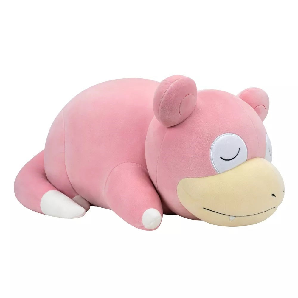 Pink Slowpoke Pokemon plush toy lying down, eyes closed, resting on a white background