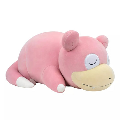 Pink Slowpoke Pokemon plush toy lying down, eyes closed, resting on a white background