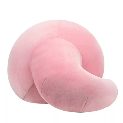 Pink, velvety plush object with a coiled, segmented shape on a white background
